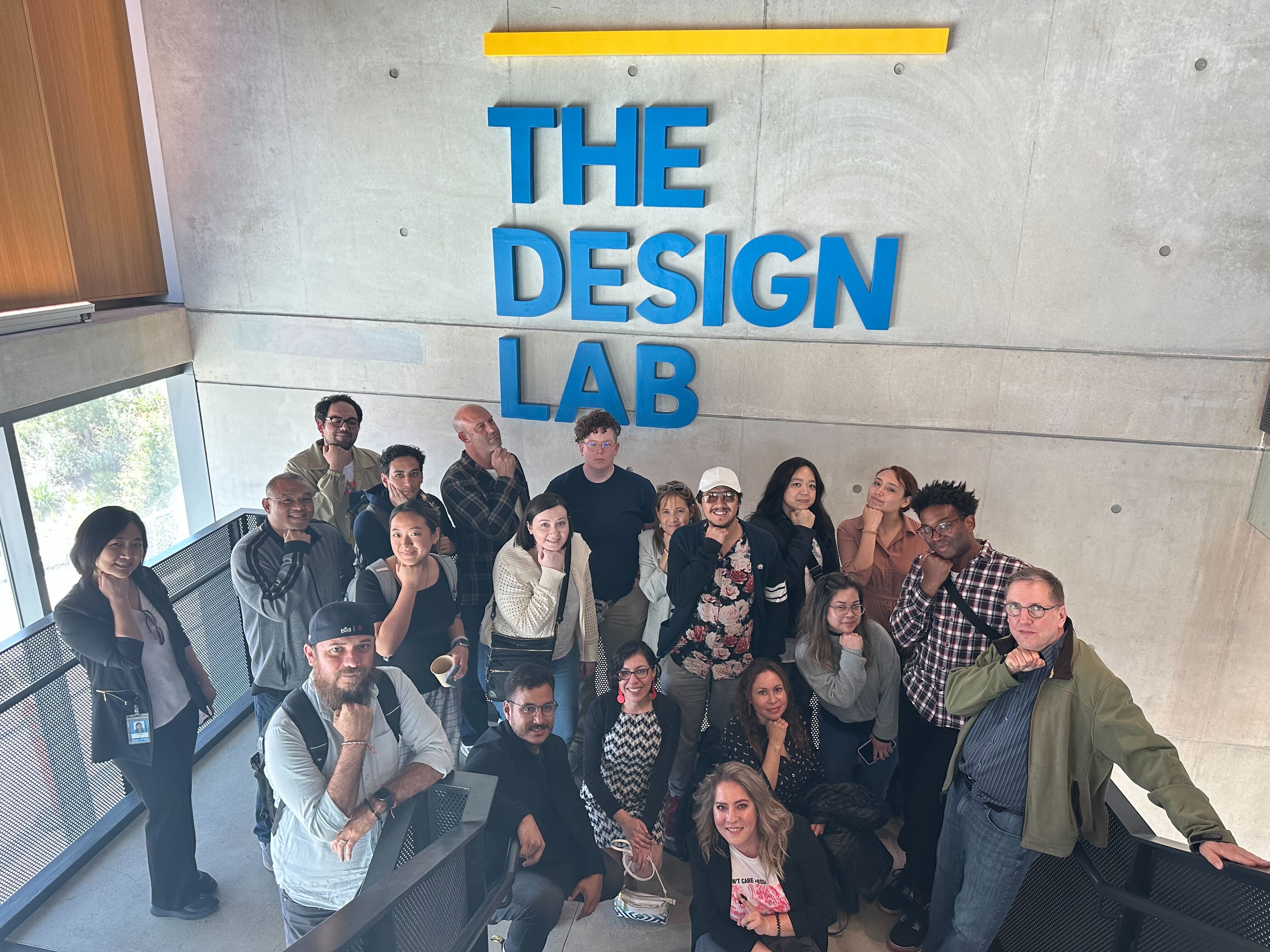 Group photo of the C4H and Insulet UX teams under The Design Lab sign.
